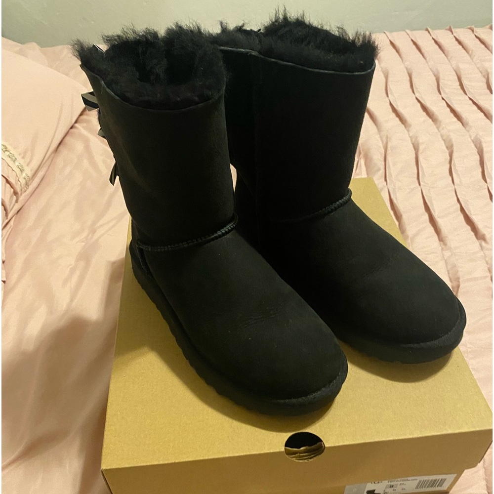 Women’s Black Uggs with black and white bows on back, Size 8